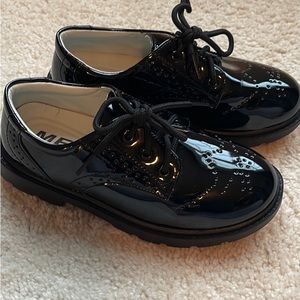 Boys like new patent leather shoes. Worn for 3 hours at wedding